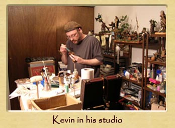 Kevin painting one of his characters